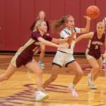 Chatfield’s Grace Schroeder (left) and Brittin Ruskell (right), Lewiston-Altura’s Maycie Mierau, all eye the play in the teams’ TRC match-up. Mierau had a game-high 34 points but Chatfield prevailed 65-52.