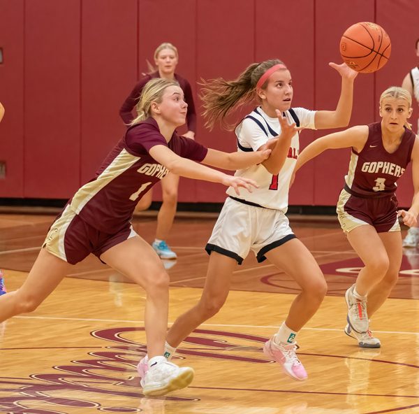 Chatfield’s Grace Schroeder (left) and Brittin Ruskell (right), Lewiston-Altura’s Maycie Mierau, all eye the play in the teams’ TRC match-up. Mierau had a game-high 34 points but Chatfield prevailed 65-52.