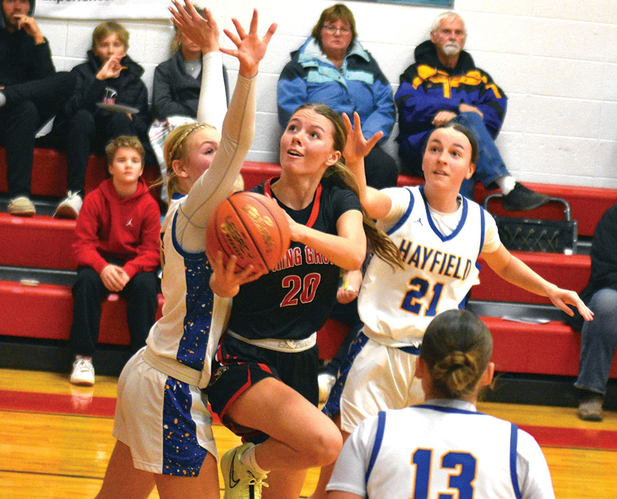 Spring Grove’s Kylie Hammel attacks amid traffic during a home win over Hayfield/Schaeffer Academy. SG’s girls (1-0, 3-1) had two tight contests on the week, the above 55-53 win and a 68-67 loss to Waukon.