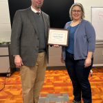 Superintendent Matt Schultz awards Christine Troendle a plaque in appreciation of her service on the Lanesboro School Board since 2013.