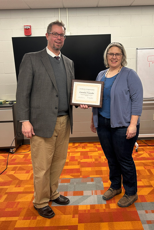 Superintendent Matt Schultz awards Christine Troendle a plaque in appreciation of her service on the Lanesboro School Board since 2013.