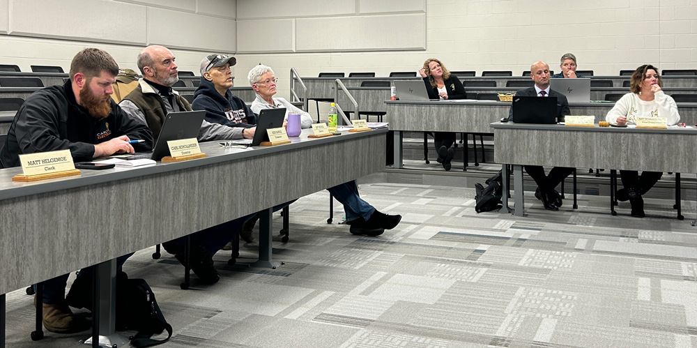 The R-P School Board watches the Truth in Taxation presentation. From left to right: Carl Schollmeier, Ken Sawle, Jeff Michel, Nancy Snyder, Business Manager Toni Oian, Superintendent Dr. Ben Bernard, HR/Payroll Manager Megan Boyum and Acting Chair Amy Woxland. Chris Grindland and Matt Helgemoe were absent.