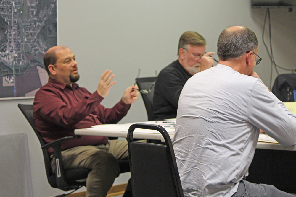 Rushford City Administrator Tony Chladek, center, discusses the lots at the Himlie Business Park at the December 9 meeting. Also pictured are realtor Rod Darr, right, and Councilor Jim O’Donnell.