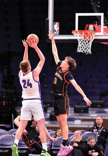 Lanesboro’s Aedan Flaby contests the shot of Grand Meadow’s Logan Grafe in the teams’ non-conference affair at the Target Center. Part of a boys/girl’s doubleheader, the Burros got the win 43-36. Photo by Ron Mayer