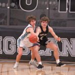 Fillmore Central’s Josh Haugerud knocks the post-entry pass away from Kingsland’s Parker Johnson. Haugerud hit a late three to tie the game, but Johnson scored a team-best 19 points, as the Knights snuck past FC 72-70 on a late Zach Reiland lay-in. Photo by Paul Trende