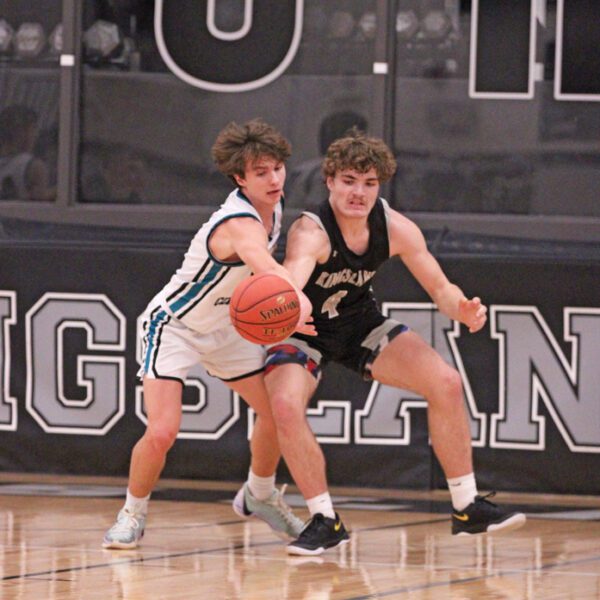 Fillmore Central’s Josh Haugerud knocks the post-entry pass away from Kingsland’s Parker Johnson. Haugerud hit a late three to tie the game, but Johnson scored a team-best 19 points, as the Knights snuck past FC 72-70 on a late Zach Reiland lay-in. Photo by Paul Trende