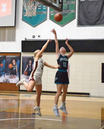 FC’s Annika Mensink takes the open interior shot over Chatfield’s Brittin Ruskell in the teams’ close TRC affair. In a game with 14 lead changes, Sophia Bronner had the go-ahead free throws with 8.4 left, as the Falcons prevailed 55-52. Photo by Deb Finseth