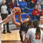 Brinley Middendorf and Lanesboro’s Emma Root collide inside in Spring Grove’s game with Lanesboro. Played at Mabel-Canton, SG won their seventh straight with a 72-49 victory. Photo by Lee Epps