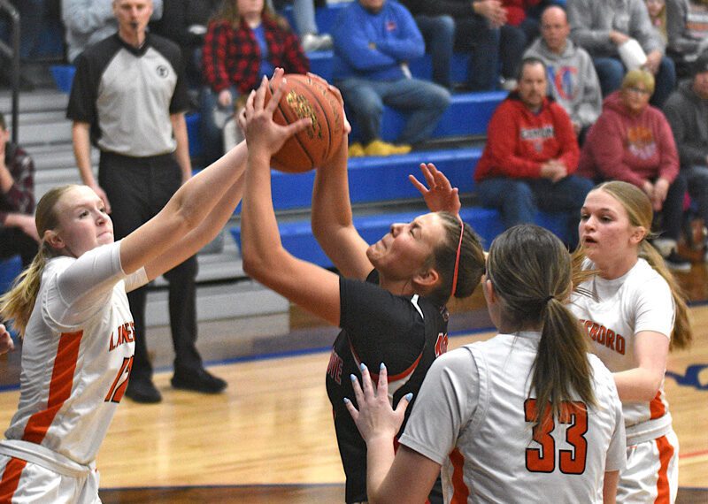 Brinley Middendorf and Lanesboro’s Emma Root collide inside in Spring Grove’s game with Lanesboro. Played at Mabel-Canton, SG won their seventh straight with a 72-49 victory. Photo by Lee Epps