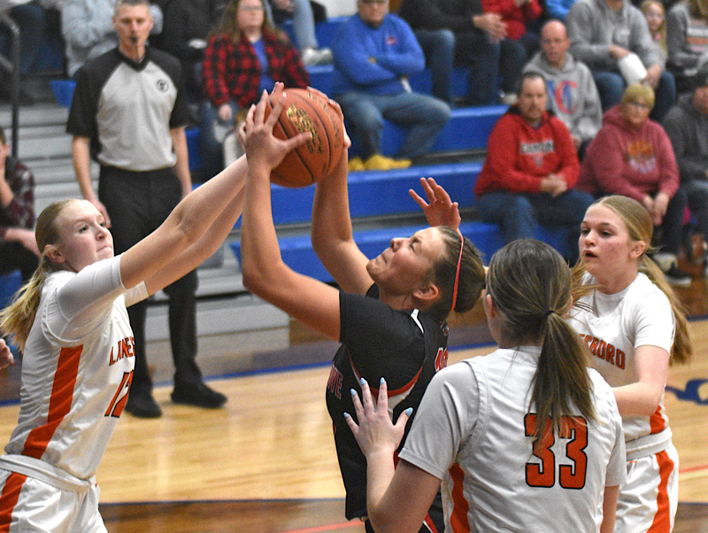 Brinley Middendorf and Lanesboro’s Emma Root collide inside in Spring Grove’s game with Lanesboro. Played at Mabel-Canton, SG won their seventh straight with a 72-49 victory. Photo by Lee Epps