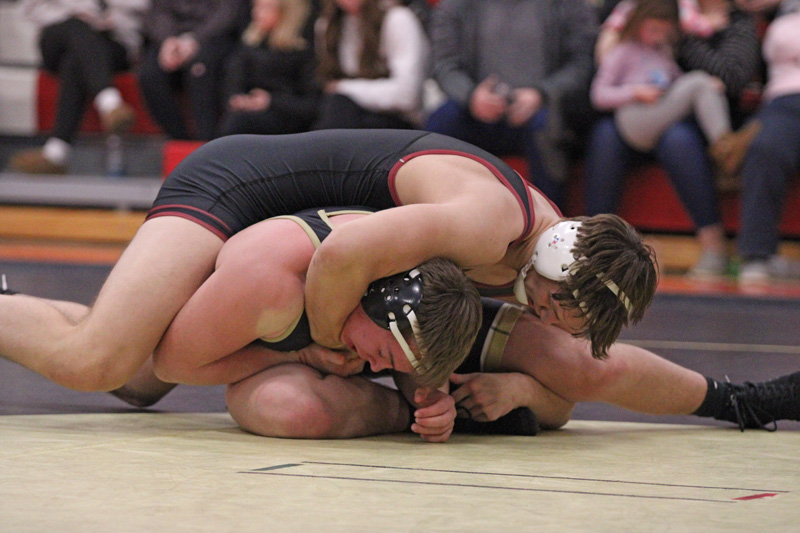 Chatfield’s Will Boelter tries to lock hands for the cradle versus Caledonia/Houston’s Aden Kulas. Boelter notched a 3-0 decision win, one of four decision victories, as part of Chatfield’s 62-0 dual meet win. Photo by Paul Trende