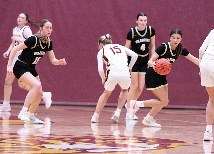 After a steal, Caledonia’s Ashlyn Reinhart starts the transition, and will find teammate Nicole Banse (left) for the score. In a battle of East and West leading TRC clubs, the #6 in AA Warriors (8-0, 13-2) beat Dover-Eyota 74-50. Photo by Paul Trende