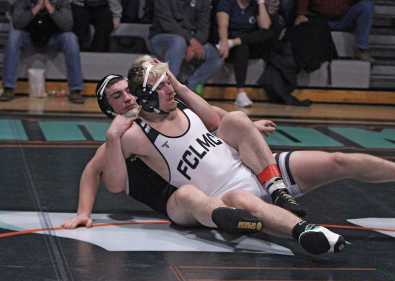 In a rematch of an earlier dual meet bout, LARP’s Zach Plank has back control of LFCMC’s Cole Sass. But unlike their first match, a Plank pin, Sass returned the favor with a pin to claim the 189-pound title at the Wolves’ holiday tourney. Photo by Paul Trende