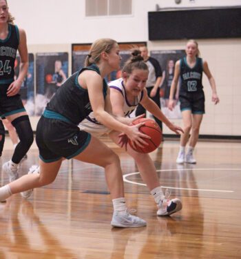 Grand Meadow’s Rylee Schaufler and Fillmore Central’s Aubrey Daniels fight for a loose ball in the teams’ non-conference affair. GM posted three wins on the week, over Southland 58-36, LeRoy-Ostrander 66-35, and the Falcons 44-37. The Larks improved to 11-2. Photo by Paul Trende