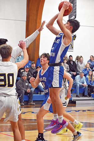 Mabel-Canton’s Isaac Underbakke rises up for a shot in the Cougars game versus Schaeffer Academy. M-C won its third straight, its nicest of the season, beating the Lions 67-62 behind Underbakke’s 23 points. Photo by Heather Kleiboer