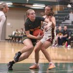 Rushford-Peterson’s Nadia Happel collects on her take to the basket past Chatfield’s Mya Henry in the teams’ TRC matchup. R-P notched two wins on the week, including topping the Gophers 75-51, to improve to 4-2 on the year. Photo by Paul Trende