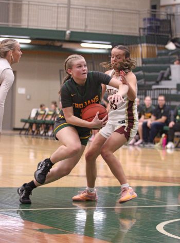 Rushford-Peterson’s Nadia Happel collects on her take to the basket past Chatfield’s Mya Henry in the teams’ TRC matchup. R-P notched two wins on the week, including topping the Gophers 75-51, to improve to 4-2 on the year. Photo by Paul Trende