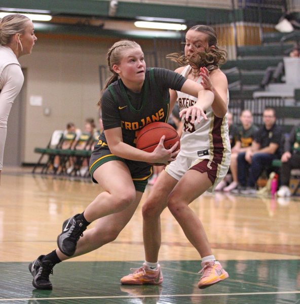 Rushford-Peterson’s Nadia Happel collects on her take to the basket past Chatfield’s Mya Henry in the teams’ TRC matchup. R-P notched two wins on the week, including topping the Gophers 75-51, to improve to 4-2 on the year. Photo by Paul Trende