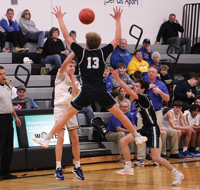 Hayfield’s Charlie Walker tosses the pass against the trapping defense of Fillmore Central’s Bridon Bahl (airborne) and Clayton Schoepski (right). The Vikings won the game 77-69, but FC rebounded with a nice 73-62 win over Lewiston-Altura, which entered with a 7-1 record. Photo by Paul Trende