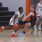 Kingsland’s Kaaleem Reiland looks to take Lanesboro’s Mason Gilbertson off the dribble. Reiland had 11 second-half points to help the Knights down the Burros 55-43 for their fourth straight and tenth win (10-5). Photo by Paul Trende