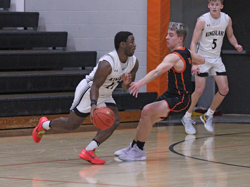 Kingsland’s Kaaleem Reiland looks to take Lanesboro’s Mason Gilbertson off the dribble. Reiland had 11 second-half points to help the Knights down the Burros 55-43 for their fourth straight and tenth win (10-5). Photo by Paul Trende