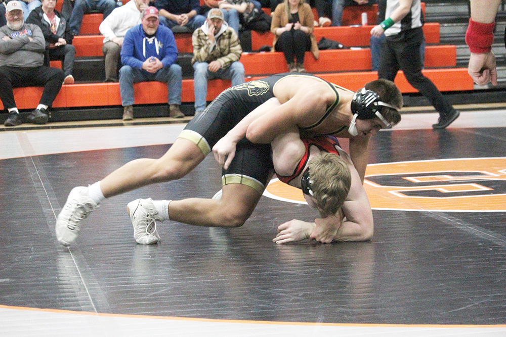 Caledonia/Houston’s Max Schmitz has top control of GMLOS’ Ayden Stier at the St. Charles triangular. In the one of the dual’s best matches, Schmitz won a 21-17 decision. The Warriors went 4-0 at duals on the week, including topping the Bulldogs 43-30. Photo submitted