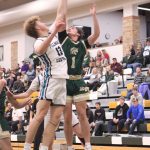 Fillmore Central’s Bridon Bahl and Rushford-Peterson’s Cole Thompson battle for a rebound at the Trojans’ holiday tourney. R-P whipped FC 86-39. Photo by Paul Trende