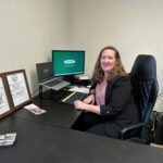 Danielle Luhmann at her desk in the Country Financial office in Rushford. Photo by Wanda Hanson