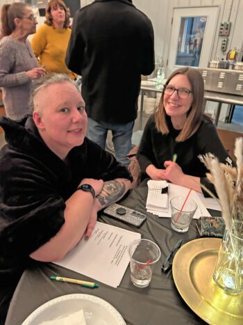 New board member Jen Gold, left, and Director Beth Weedman chatted after the business meeting. Photo by Wanda Hanson