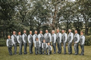 The groom and his groomsmen. Front row from left to right: Jaxon Klug, Jakob Klug, and Greyson Hoscheit. Back row left to right: Kole Klug, Evan Schmidt, Gregory Sanness, Ben Sanness, Bob Burmester, Jason Klug, Brad Hoscheit, Jacob Hoscheit, Nate Klug, Kyle Welscher, Nate Kinstler, Nathan Brant, Cole Hoscheit and Kaden Klug. Photo by Sydnie and Me Photography