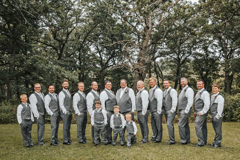 The groom and his groomsmen. Front row from left to right: Jaxon Klug, Jakob Klug, and Greyson Hoscheit. Back row left to right: Kole Klug, Evan Schmidt, Gregory Sanness, Ben Sanness, Bob Burmester, Jason Klug, Brad Hoscheit, Jacob Hoscheit, Nate Klug, Kyle Welscher, Nate Kinstler, Nathan Brant, Cole Hoscheit and Kaden Klug. Photo by Sydnie and Me Photography