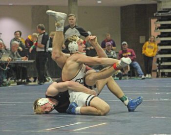 FCLMC’s Kane Larson (upright) and Chatfield’s Ben Carrier (face on mat) get all tangled as they tangle in the 172-pound final at the Section 1A individual wrestling tourney. In the event’s best finals match, #3 Carrier topped #2 Larson by 3-1 decision, but each have qualified for state. Photo by Paul Trende