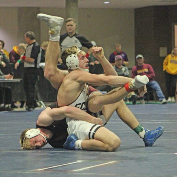 FCLMC’s Kane Larson (upright) and Chatfield’s Ben Carrier (face on mat) get all tangled as they tangle in the 172-pound final at the Section 1A individual wrestling tourney. In the event’s best finals match, #3 Carrier topped #2 Larson by 3-1 decision, but each have qualified for state. Photo by Paul Trende