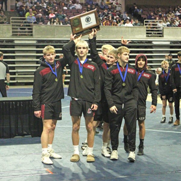 Five Chatfield seniors (left to right) Ben Carrier, Ayden Miner, Alden Pearson, Carson Rowland, and Javier Berg plus a mostly-occluded Wyatt Jacobson gather around the Section 1A team wrestling trophy. The Gophers dominatingly repeated as champs, beating three foes by a combined 192-23 score. Photo by Paul Trende