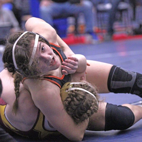 FCLMC 8th grader Charlotte Ferrie uses the headlock to pin Northfield’s #6 Lainey Houts, as #10 Ferrie trailed 6-0 in the match. Said win was huge in securing Ferrie a trip to state as the Section 1/2 runner-up at 130-pounds. Photo by Paul Trende