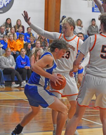 Mabel-Canton’s Darian Hershberger encounters Lanesboro Levi Rogers in the teams’ SEC contest. M-C slipped past the Burros 58-56. Lanesboro’s week included beating Spring Grove 52-33, sweeping the season series. Photo by Heather Kleiboer