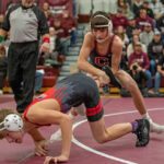 GMLOS’ Logan Gregerson tries to escape from Jameson Priebe at Chatfield’s triangular. Priebe started the dual with one of eight first period pins in a 72-6 Gopher win. Photo by Leif Erickson