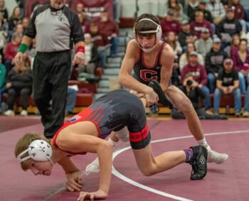 GMLOS’ Logan Gregerson tries to escape from Jameson Priebe at Chatfield’s triangular. Priebe started the dual with one of eight first period pins in a 72-6 Gopher win. Photo by Leif Erickson