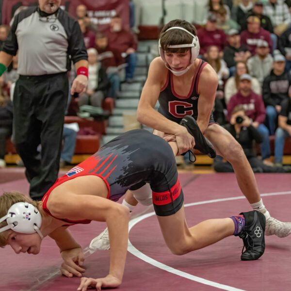 GMLOS’ Logan Gregerson tries to escape from Jameson Priebe at Chatfield’s triangular. Priebe started the dual with one of eight first period pins in a 72-6 Gopher win. Photo by Leif Erickson