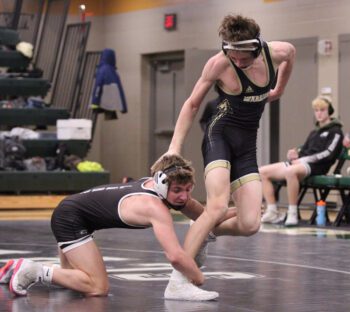 Caledonia/Houston’s Aaren Kulas tries to escape from Christian Zibrowski amidst LARP’s triangular. Zibrowski notched a 15-0 tech fall in the match, but the Warriors won the dual 32-28 while also beating D-E 50-18. Photo by Paul Trende