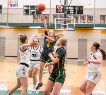 Rushford-Peterson’s Alannah Skalet flips up the lane shot versus Kingsland. The Trojans’ week was of note for hitting 17 threes in a 73-15 win over the Knights and redeeming a loss to Lanesboro by 81-50 final, where they hit 10 more trifectas. Photo by Dawn Hauge