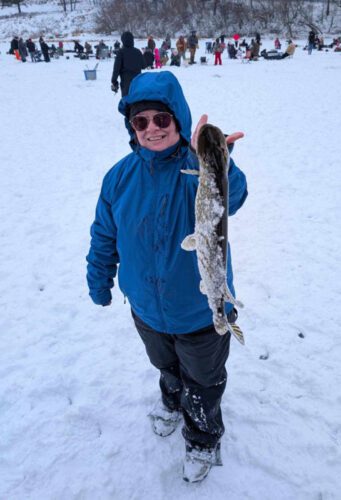 Allyssa Stockton with her prize-winning 22.5-inch northern pike at the Lanesboro Memorial Ice Fishing Tournament 2025.