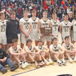A relatively somber bunch of Caledonia Warriors poses with their state Class AA Fourth Place trophy. Team Cal went 1-2 at state, but in each of their losses, they resiliently came back to tie after trailing by 20-plus points. The Warriors finish an excellent year with a 29-4 record. Photo by Paul Trende