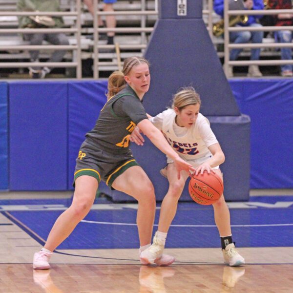 Rushford-Peterson lone senior Nevaeh Happel looks to get the steal from Southland’s Brynlee Koenigs in the teams’ 1A quarterfinal. The Trojans prevailed 58-39 in the game, but then fell to 1-seed, #1 in Class Goodhue 74-51 in the semifinals to finish a good year 17-10. Photo by Paul Trende