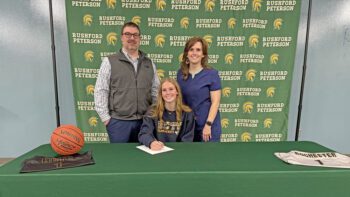 Rushford-Peterson’s Nevaeh Happel has signed a letter of intent to play basketball and Rochester Community and Technical College. She is pictured with her parents Josh and Trina Happel. Photo submitted