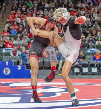 Staples-Motley’s Colbe Tappe has a leg up on Chatfield’s Ayden Miner literally and figuratively in the 160-pound state finals match. Miner fell to Tappe, who buzz-sawed his way to the championship with two pins, two tech falls. But the Gopher senior (43-5) finished as a still very respectable state runner-up. Photo by Leif Erickson