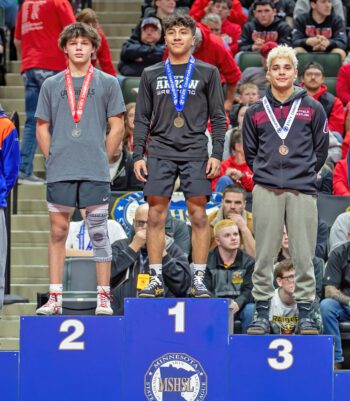 Chatfield’s Javier Berg (right) culminated a fantastic wrestling career by notching a third straight top three placing on the state stage. Berg (37-3) took third at 121-pounds. He was state champ at 106 in 2023 and runner-up last year at 114. Photo by Leif Erickson