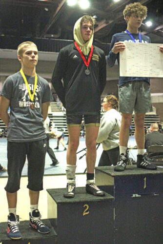 Caledonia/Houston’s Aiden Burns (31-11), pictured above as runner-up at 114-pounds at the Section 1A Meet, continued his strong season by taking fifth on the state stage. He went 4-2 in St. Paul, losing two matches by a combined 9-6 score, each to ranked foes. Photo by Paul Trende