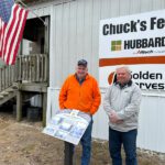 New owners Eric Nierstheimer, left, and Terry Barth pose outside Chuck’s Feed & Grain. Photo by Wanda Hanson