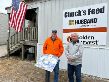 New owners Eric Nierstheimer, left, and Terry Barth pose outside Chuck’s Feed & Grain. Photo by Wanda Hanson